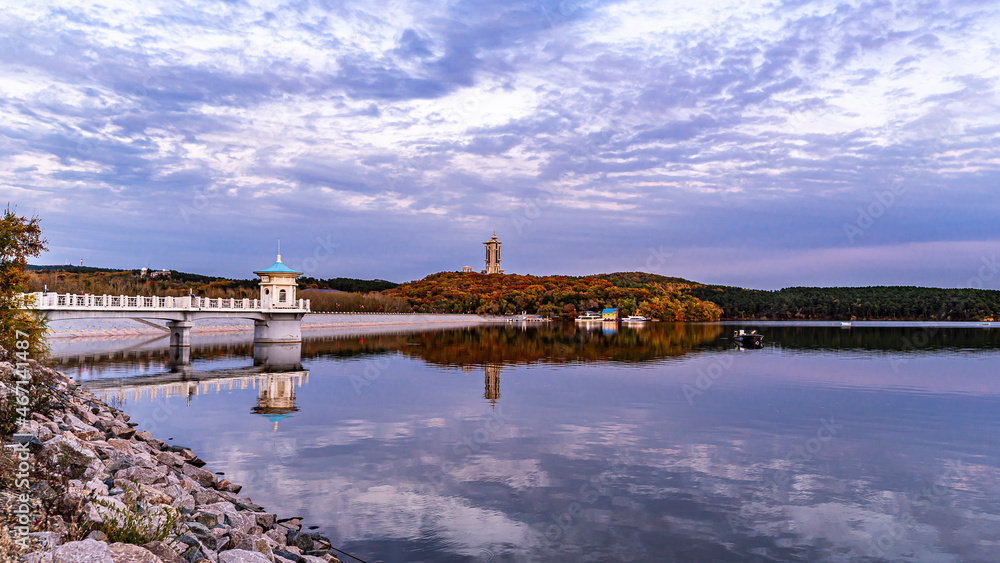 Autumn landscape of Jingyuetan National Forest Park in Changchun, China under the setting sun