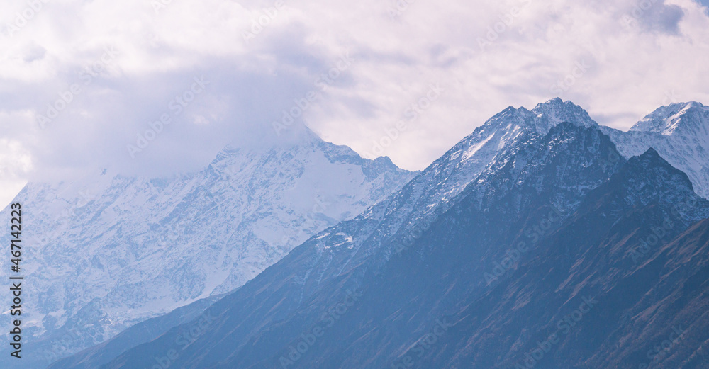 Rocks high in the mountains.. Mountain view on a clear autumn day. Mountains in Ingushetia. Landscape in the mountains in autumn. Rocks and trees in a mountainous area. Rocks high in the mountains.. Mountain view on a clear autumn day. Mountains in Ingushetia. Landscape in the mountains in autumn. Rocks and trees in a mountainous area.