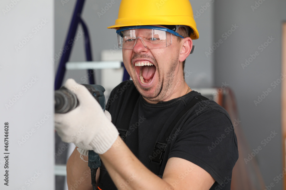 Handyman make hole with device Handyman make hole with device