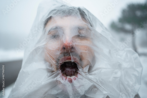 Suffocated man trapped in plastic during winter