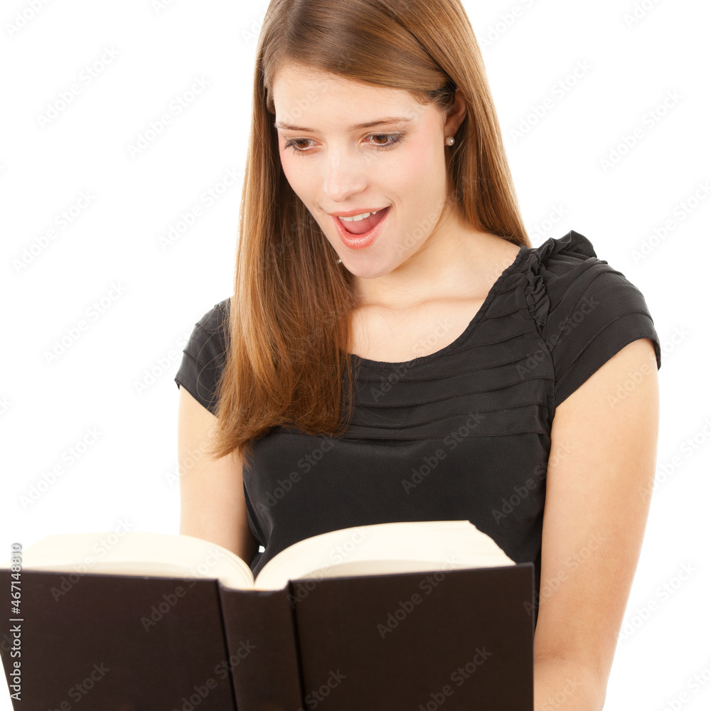 Beautiful girl holding and reading her book, studio shot on white background Beautiful girl holding and reading her book, studio shot on white background