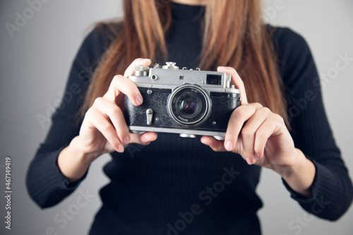 Vintage Camera in female hand.