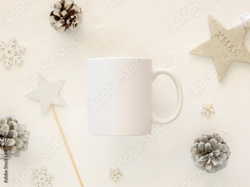 Christmas winter mug mockup. Xmas decorations and white ceramic cup for imprint branding. Flat lay, top view, copy space