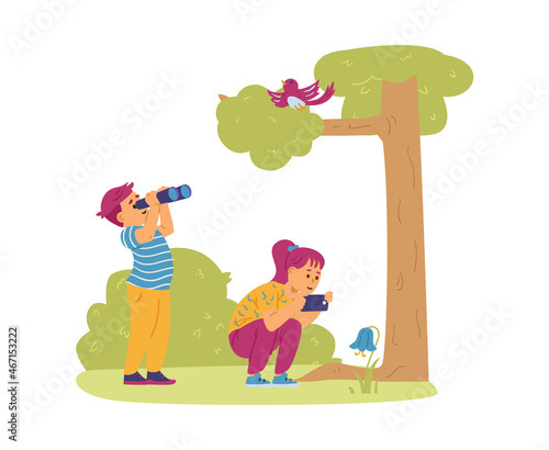 Kids Bird Watching and Take Photos of Bluebell Flower. Boy and girl explore nature in the forest on summer vacation.