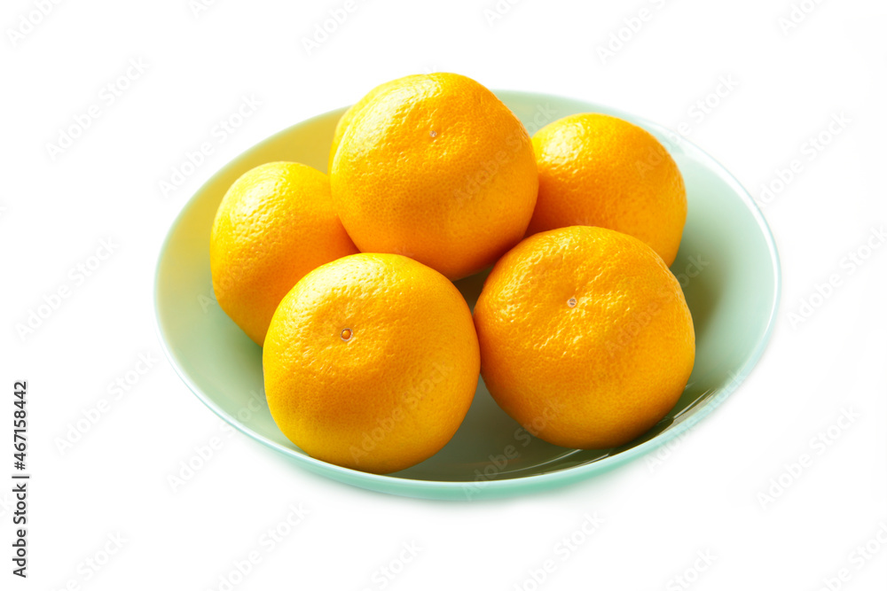 Fresh mandarin oranges fruit on mint bowl isolated on white background. Fresh mandarin oranges fruit on mint bowl isolated on white background.