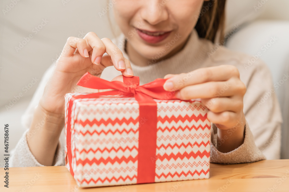 Celebrate on Christmas eve, new year festival season, asian pretty smiling young woman, girl holding and opening gift box, happy to get present on birthday, merry xmas. Moment of celebration people. Celebrate on Christmas eve, new year festival season, asian pretty smiling young woman, girl holding and opening gift box, happy to get present on birthday, merry xmas. Moment of celebration people.