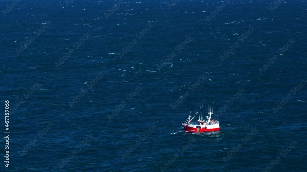 Aerial view of a fishing boat fishing in the Cantabrian Sea, Cantabria, Spain, Europe Aerial view of a fishing boat fishing in the Cantabrian Sea, Cantabria, Spain, Europe