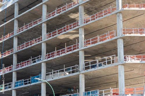 Facade of high-rise concrete building under constraction