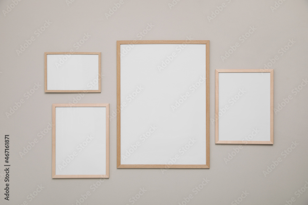 Empty frames on grey wall. Mockup for design Empty frames on grey wall. Mockup for design