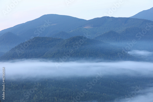 Beautiful view of foggy mountains covered with forest