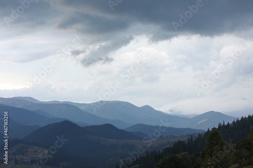 Beautiful view of majestic mountains under cloudy sky