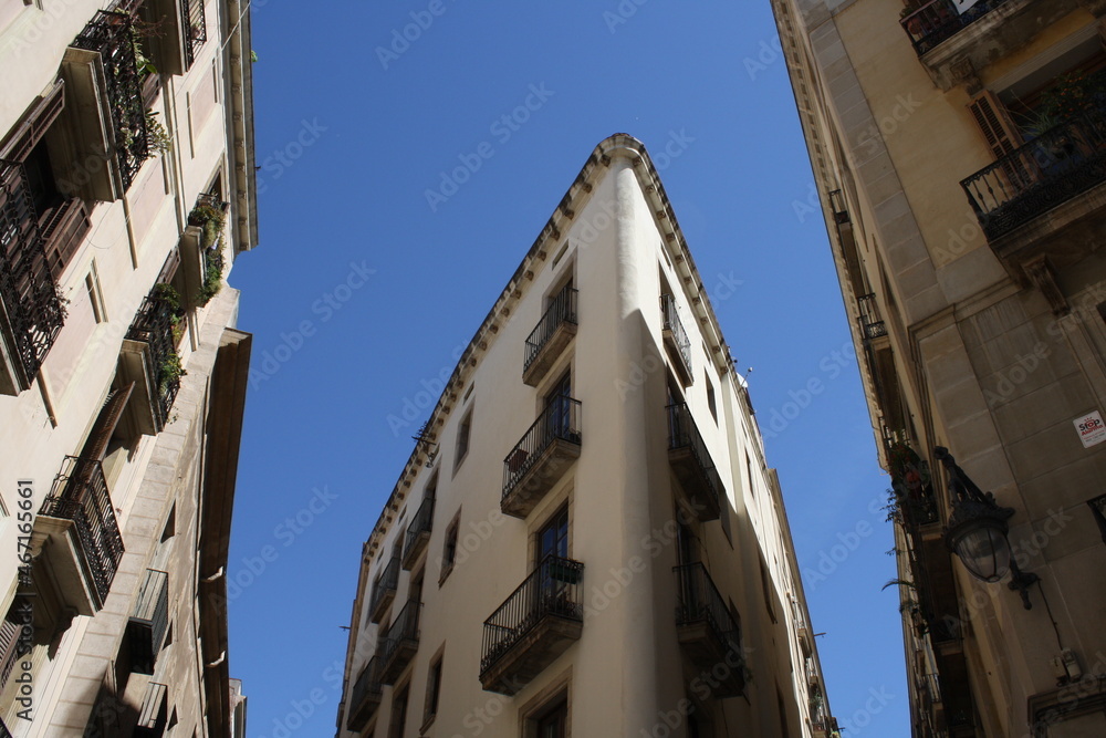 old gothic buildings on the streets of barcelona city in a summer day