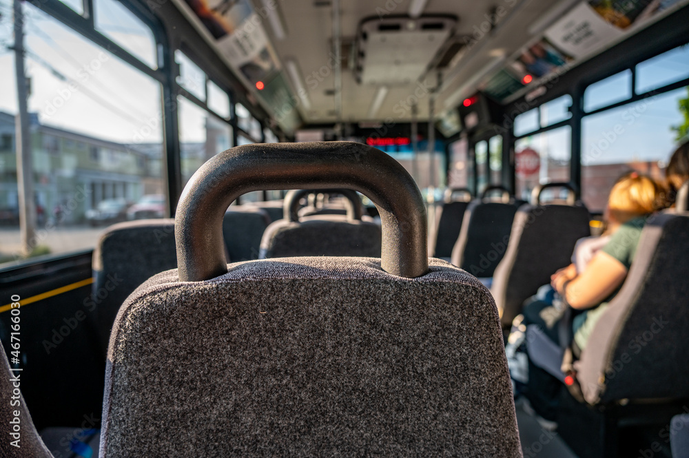 Naklejka premium Single mother with children on the way to work in the morning on an empty bus