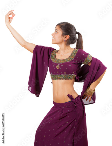 Beautiful indian young brunette dancing