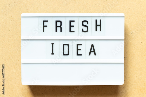 Lightbox with word fresh idea on wood background