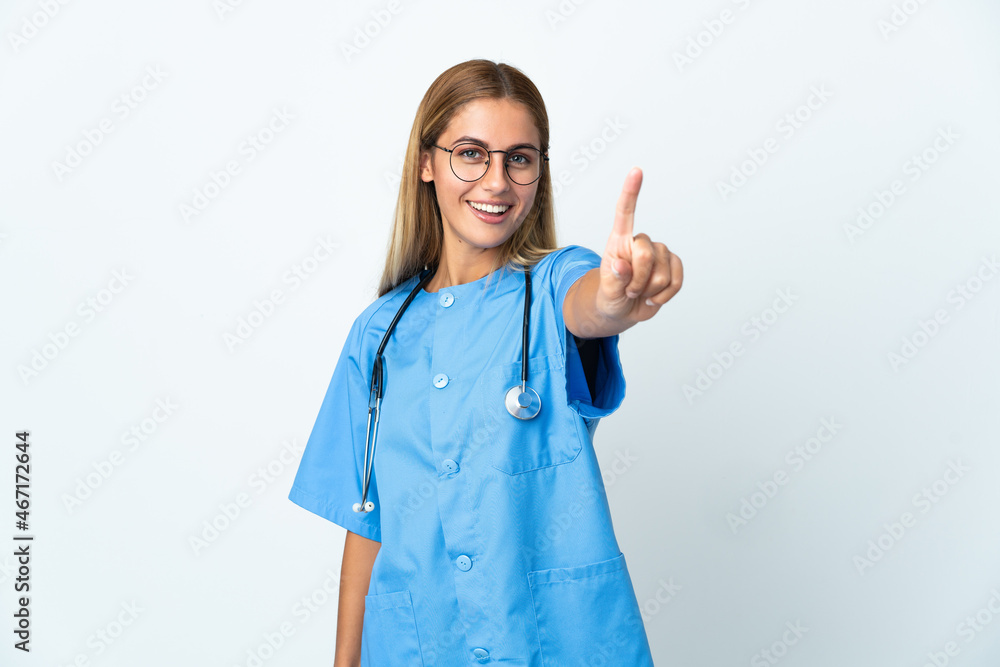 Surgeon doctor woman over isolated white background showing and lifting a finger Surgeon doctor woman over isolated white background showing and lifting a finger