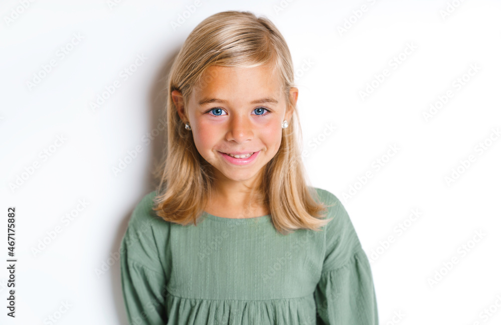 Little child smiling and looking at camera on studio Little child smiling and looking at camera on studio