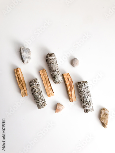 bunches of white California sage on a white background, minimalism and a place for text. sacred incense, aromatherapy and meditation