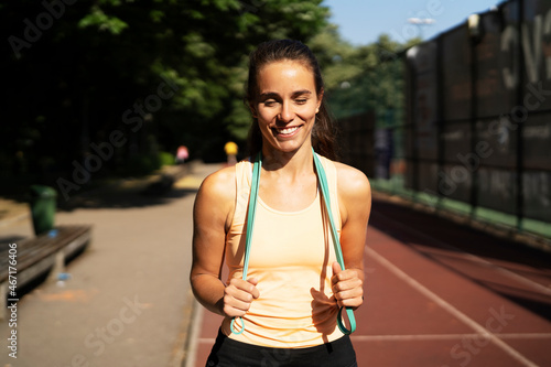 Beautiful athlete woman in sportswear. Young woman pripering for the training outdoors © JustLife