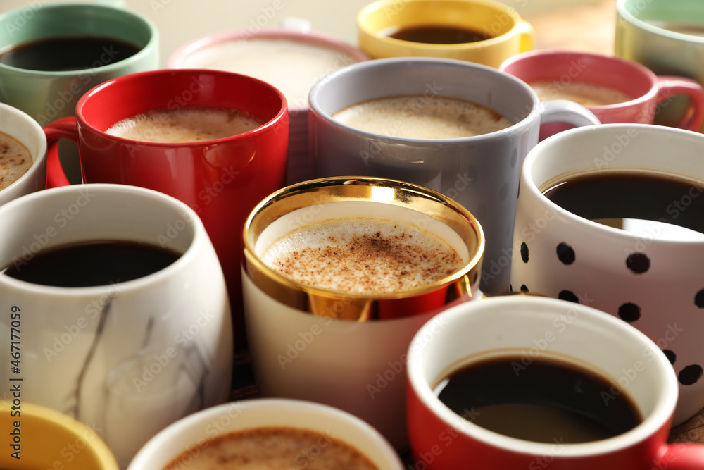 Many cups of different coffees on table, closeup Many cups of different coffees on table, closeup