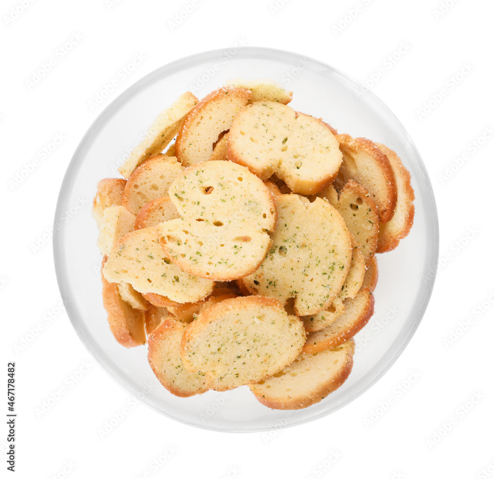 Crispy rusks with seasoning in bowl isolated on white, top view Crispy rusks with seasoning in bowl isolated on white, top view