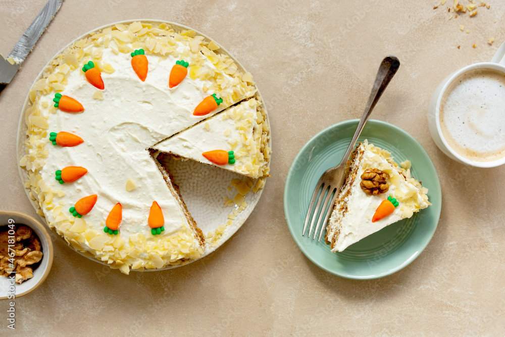 Carrot cake with walnuts an whipped cream, homemade easter cake baking, top view. Whole round cake. Carrot cake with walnuts an whipped cream, homemade easter cake baking, top view. Whole round cake.