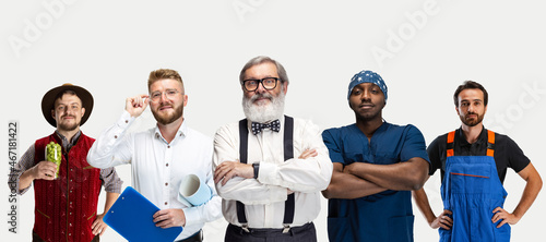 Horizontal flyer with of mixed-age men in image of waiter, professor, doctor, mechanic standing together isolated on white studio background. © master1305