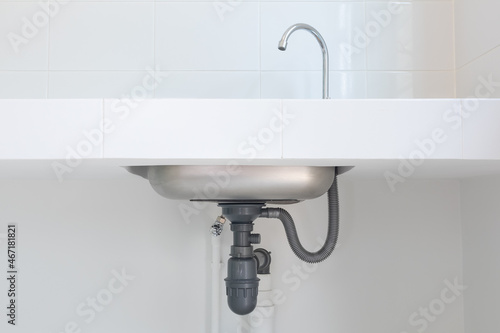Foto Drain pipe or sewer under kitchen sink
