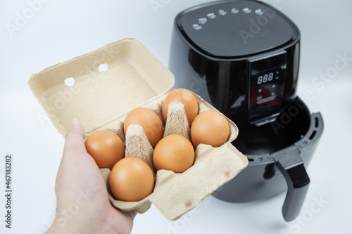 6 eggs, about to fry in an oil-free fryer.