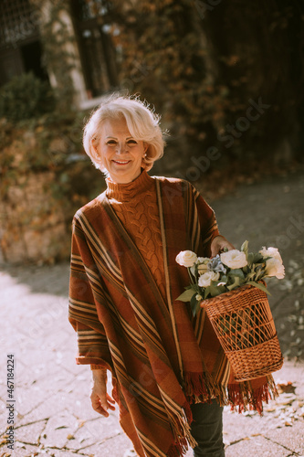Senior woman walking with b...