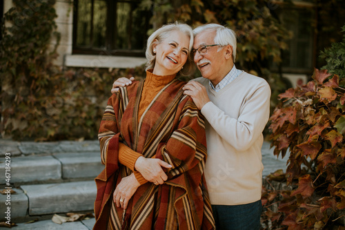 Senior couple embracing in autumn park