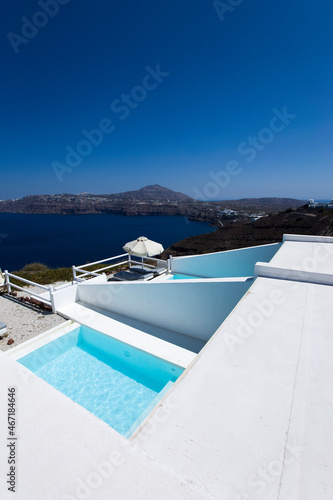 Swimming pool overlookig Aegean sea on Satorini island, Greece © BGStock72