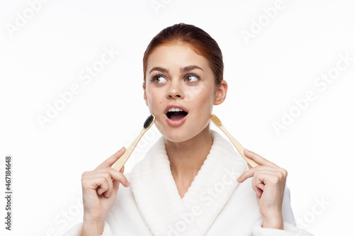 contact woman in white robe toothbrushes bathroom hygiene