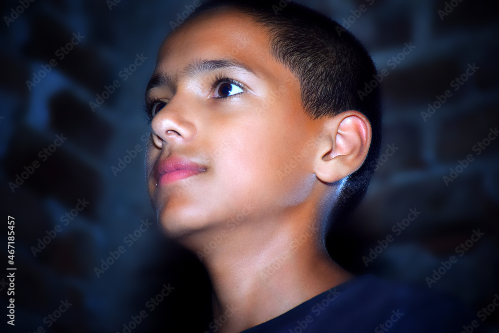 Portrait of a stylish boy, shot in dark studio with neon light. Portrait of a stylish boy, shot in dark studio with neon light.