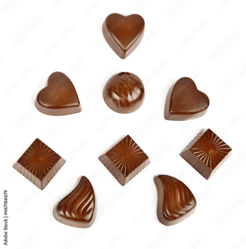 Various chocolate pralines isolated on white . Top view. Various chocolate pralines isolated on white . Top view.