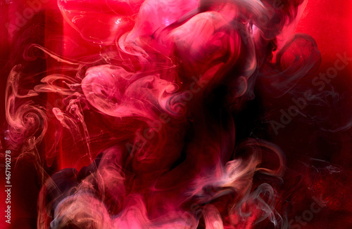 Red black pigment swirling ink abstract background  liquid smoke paint underwater