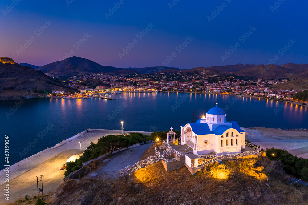 Fototapeta premium The small church of Agios Nikolaos at the entrance of the port of Myrina on the island of Lemnos in Greece