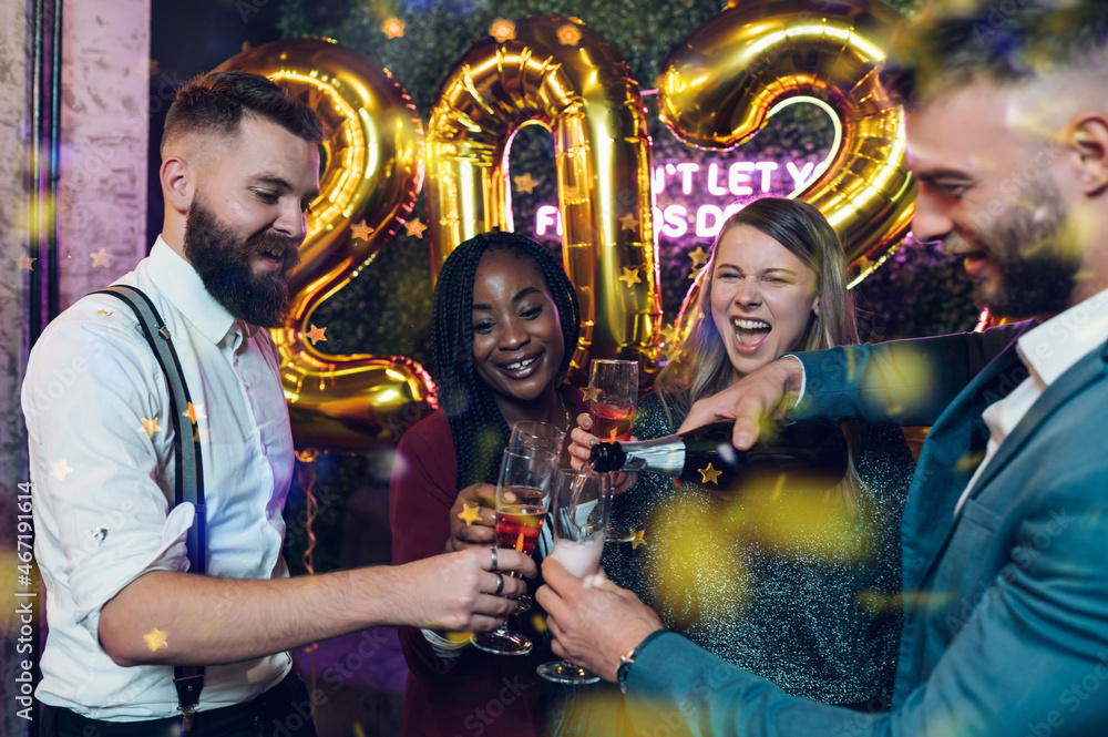 Happy group of friends celebrate New Year's Eve in a club Happy group of friends celebrate New Year's Eve in a club