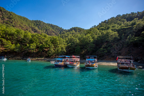 Sea trip to the Turkish island of Suluada with white sand and emerald water. A delightful place to relax and sunbathe.