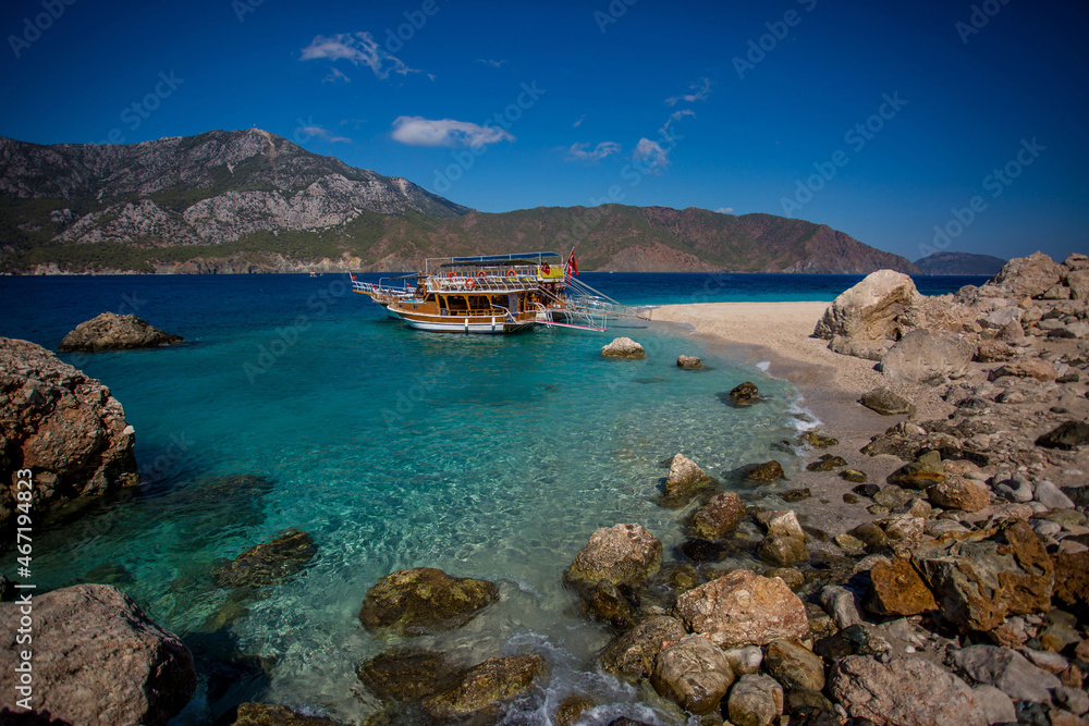 Sea trip to the Turkish island of Suluada with white sand and emerald water. A delightful place to relax and sunbathe.