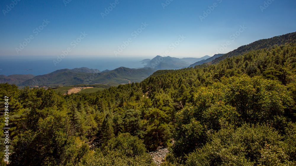 Jeep trip in the mountains of Turkey along the Lycian trail. Magnificent views from the height. Pine forest and rocks. Sea view from the top.