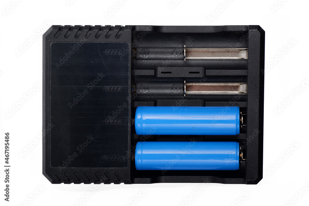 battery charger, with two batteries in it, isolated on a white background battery charger, with two batteries in it, isolated on a white background