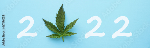 2022 with Cannabis leaf top view. Happy new year banner. Marijuana legalization photo
