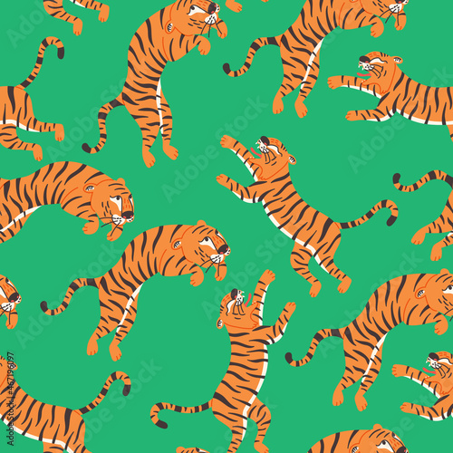 Seamless pattern attacking tiger on green background. Wild Cat predator orange and black vector modern flat style background