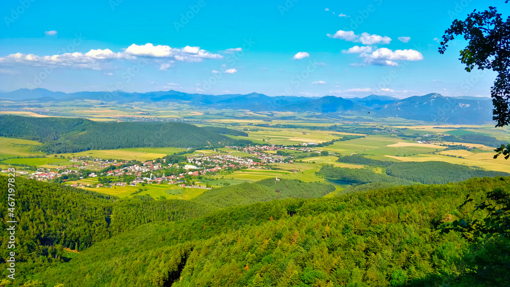 View into the valley with village and mountains in the background in Slovakia.