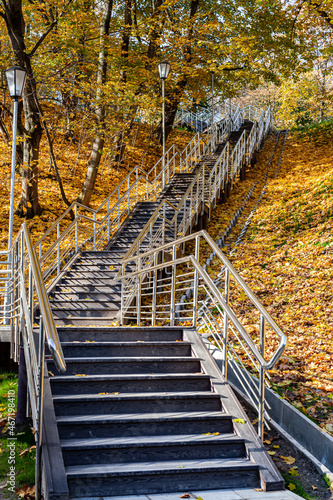 Fototapeta Naklejka Na Ścianę i Meble -  metal stairs in the park leading up the hill