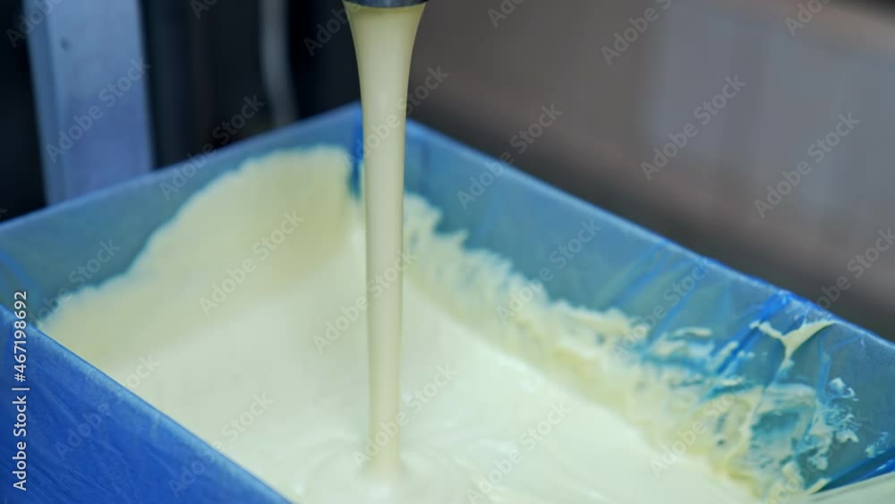 Butter in production line. Close up of butter industry process Butter in production line. Close up of butter industry process
