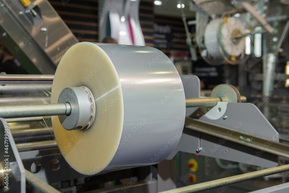Roll of packaging plastic film on shaft Roll of packaging plastic film on shaft