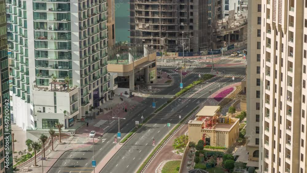 Aerial view of JBR street with heavy traffic timelapse. Dubai road and intersections. Aerial view of JBR street with heavy traffic timelapse. Dubai road and intersections.