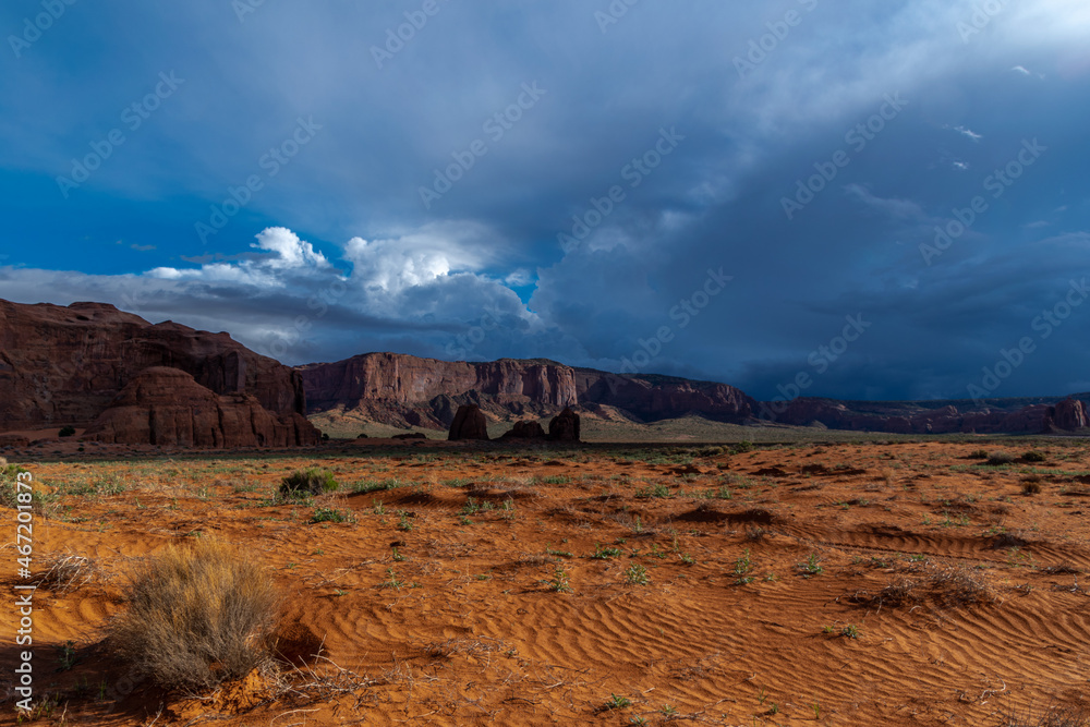 Tranquil southwest scene with storm clouds rolling into Monument Valley area
